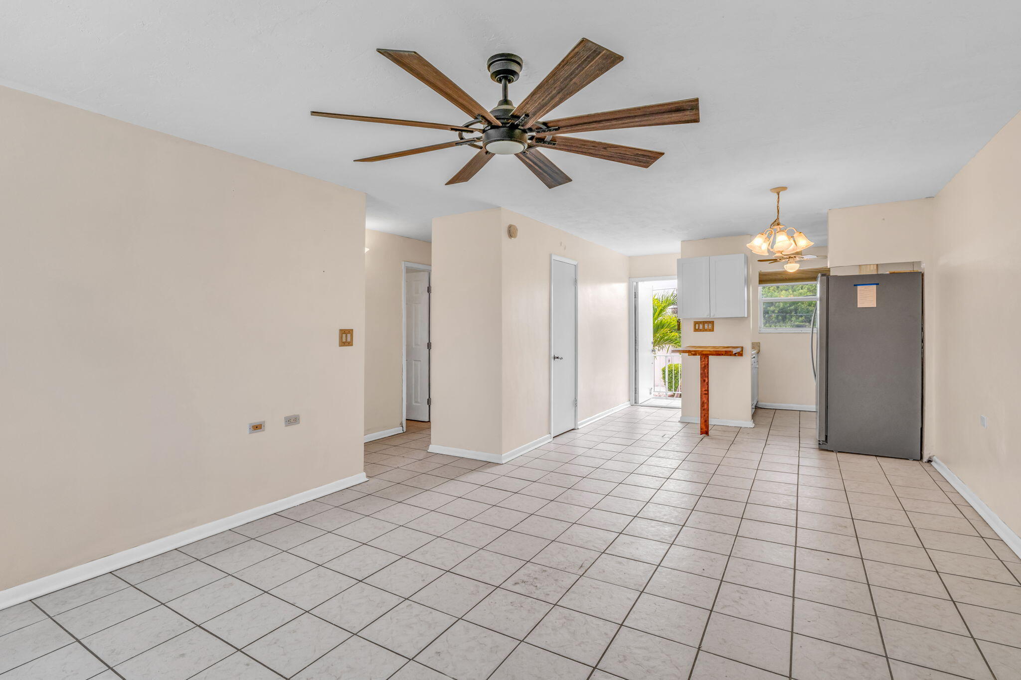 5301 Ocean Terrace, Unit 6 Marathon, FL 33050 - Photo 17 of 38 a view of a livingroom with a chandelier fan and furniture