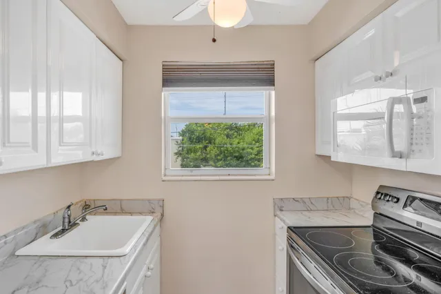 a bathroom with a sink and a window