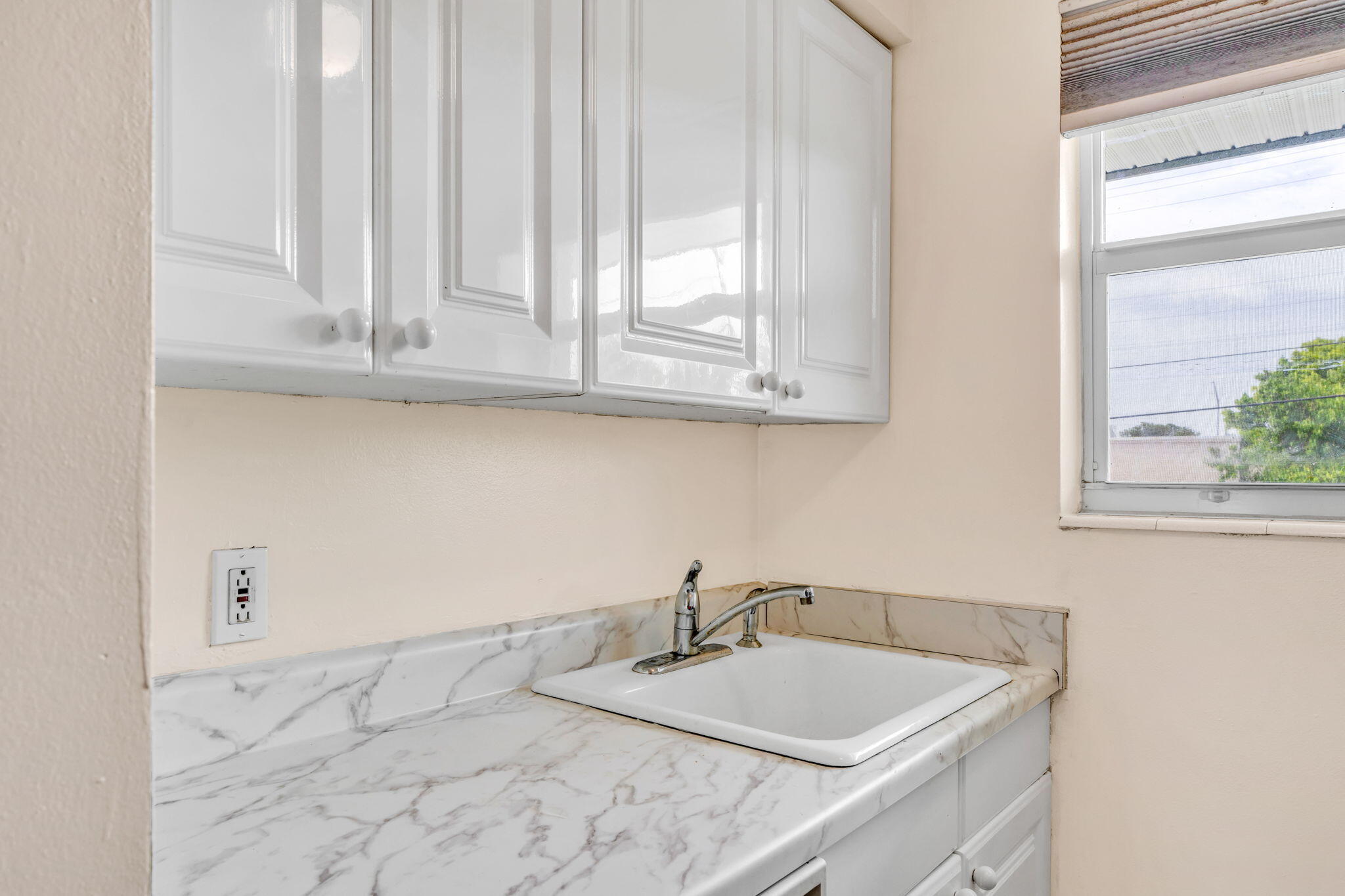 5301 Ocean Terrace, Unit 6 Marathon, FL 33050 - Photo 21 of 38 a bathroom with a sink and a mirror