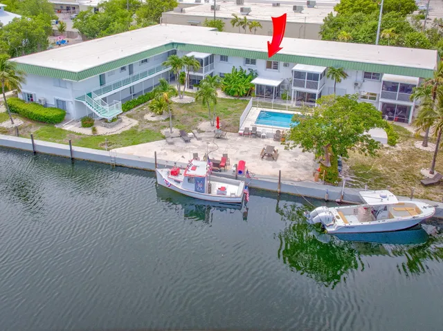 a front view of a house with a yard table and chairs