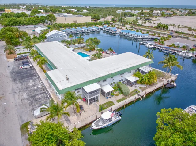 an aerial view of a house with a ocean view