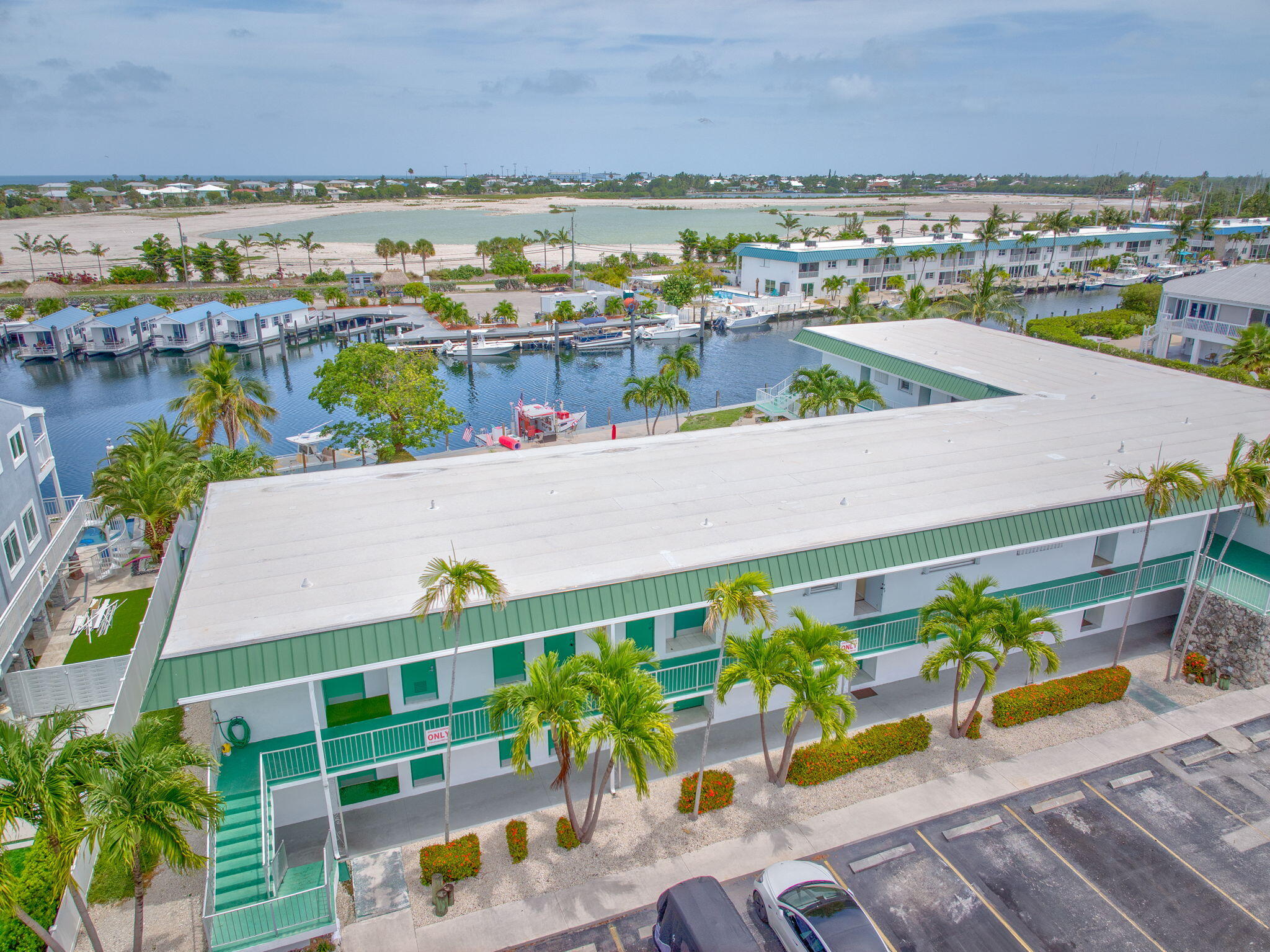 5301 Ocean Terrace, Unit 6 Marathon, FL 33050 - Photo 4 of 38 an aerial view of a balcony with lawn chairs