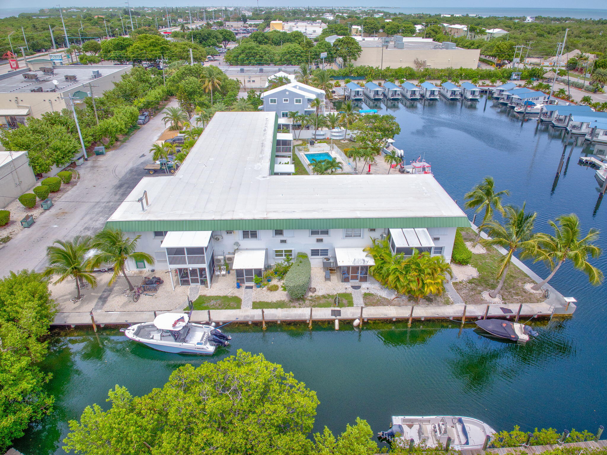5301 Ocean Terrace, Unit 6 Marathon, FL 33050 - Photo 6 of 38 an aerial view of a house with swimming pool lake view and boat