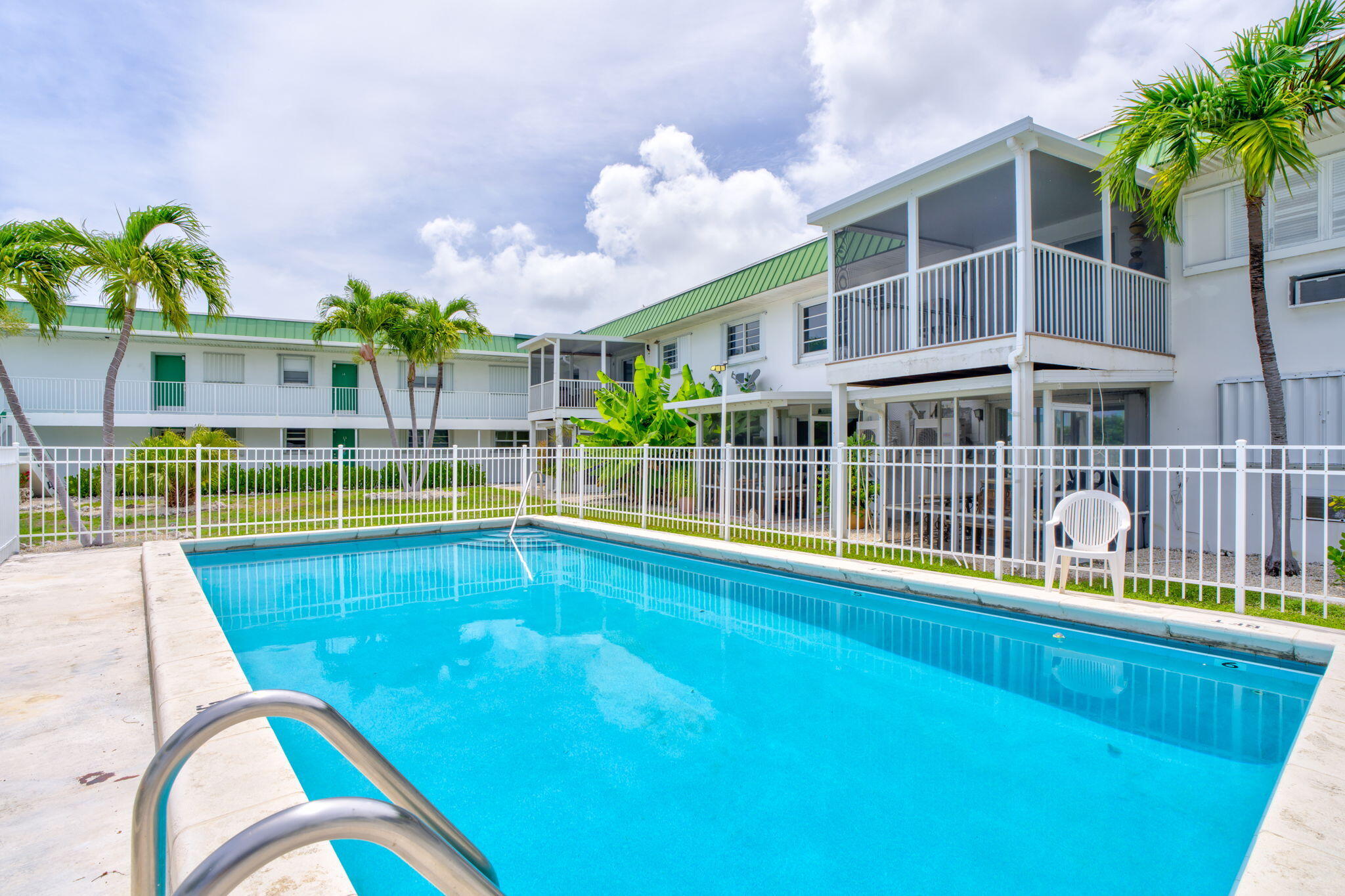 5301 Ocean Terrace, Unit 6 Marathon, FL 33050 - Photo 10 of 38 a view of a swimming pool with a patio
