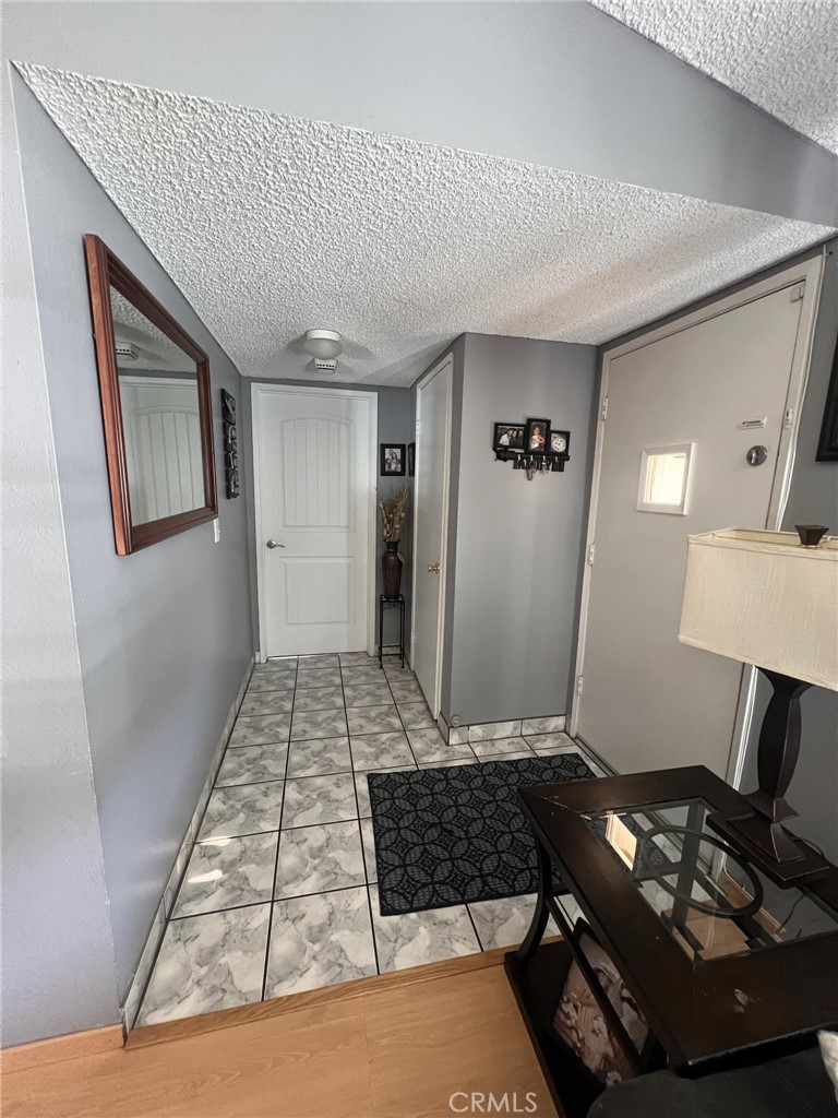 591 North Smoke Tree Avenue Rialto, CA 92376 - Photo 18 of 48 a living room with furniture and a table