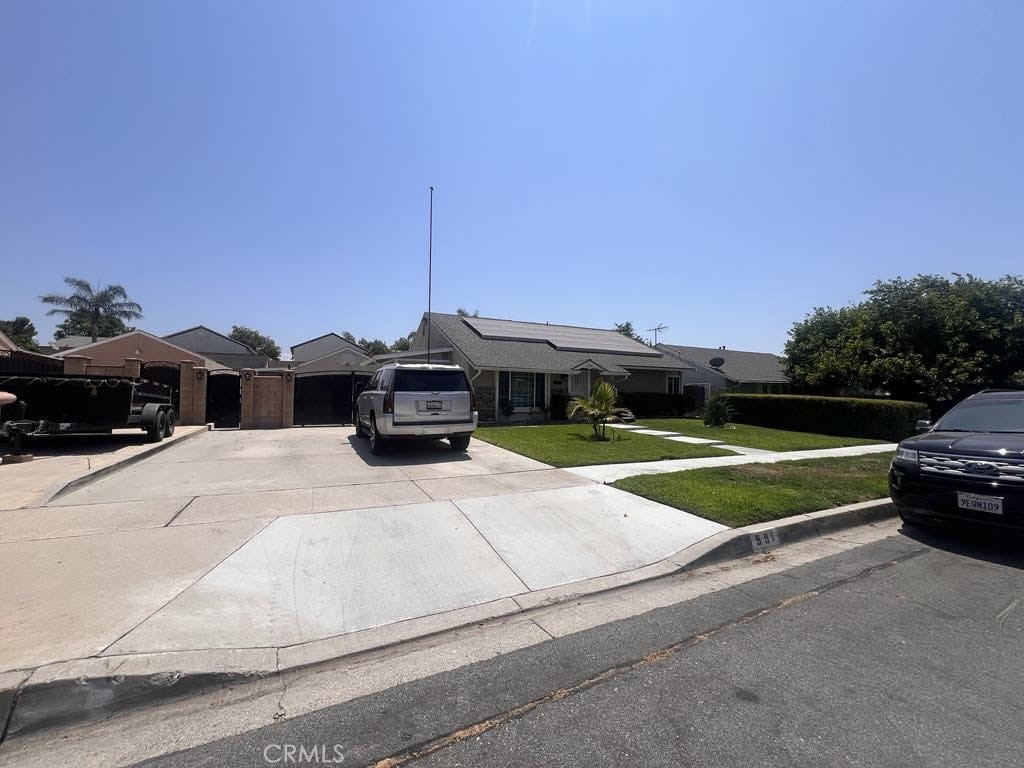 591 North Smoke Tree Avenue Rialto, CA 92376 - Photo 2 of 48 a front view of a house with a yard