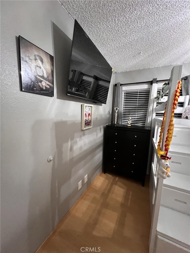 591 North Smoke Tree Avenue Rialto, CA 92376 - Photo 21 of 48 a living room with furniture and a flat screen tv