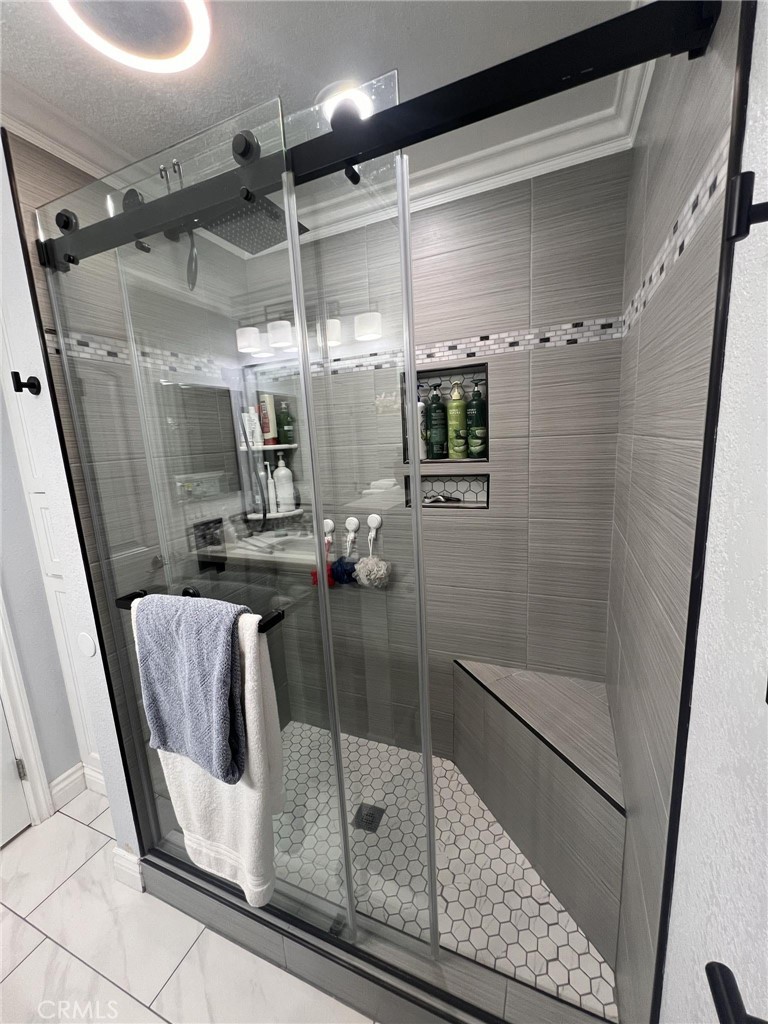 591 North Smoke Tree Avenue Rialto, CA 92376 - Photo 27 of 48 a bathroom with a shower