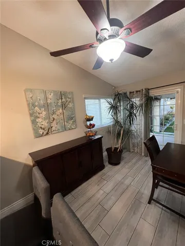 a spacious bedroom with a bed and a couch