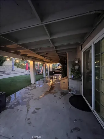 a view of a house with backyard outdoor seating area and furniture
