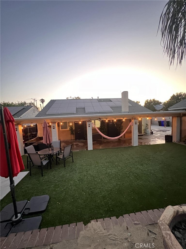 591 North Smoke Tree Avenue Rialto, CA 92376 - Photo 46 of 48 a view of a house with backyard outdoor seating area and furniture