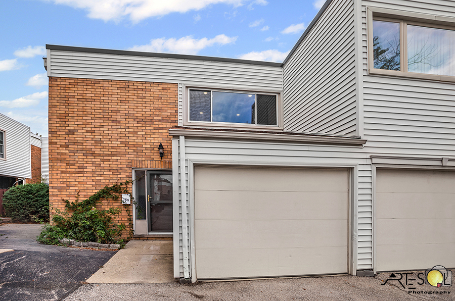 368 Cedar Tree Court Hoffman Estates, IL 60169 - Photo 1 of 1 a front view of a house with large windows