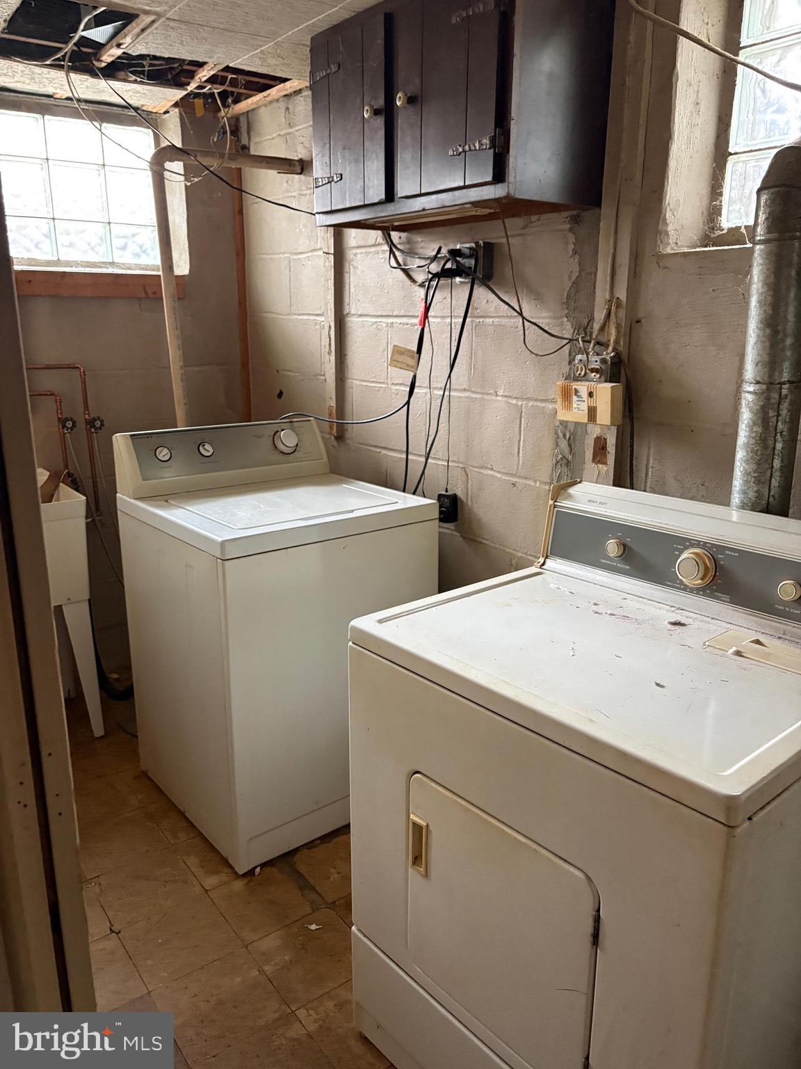 7832 Rockbourne Road Baltimore, MD 21222 - Photo 15 of 20 a utility room with dryer and washer