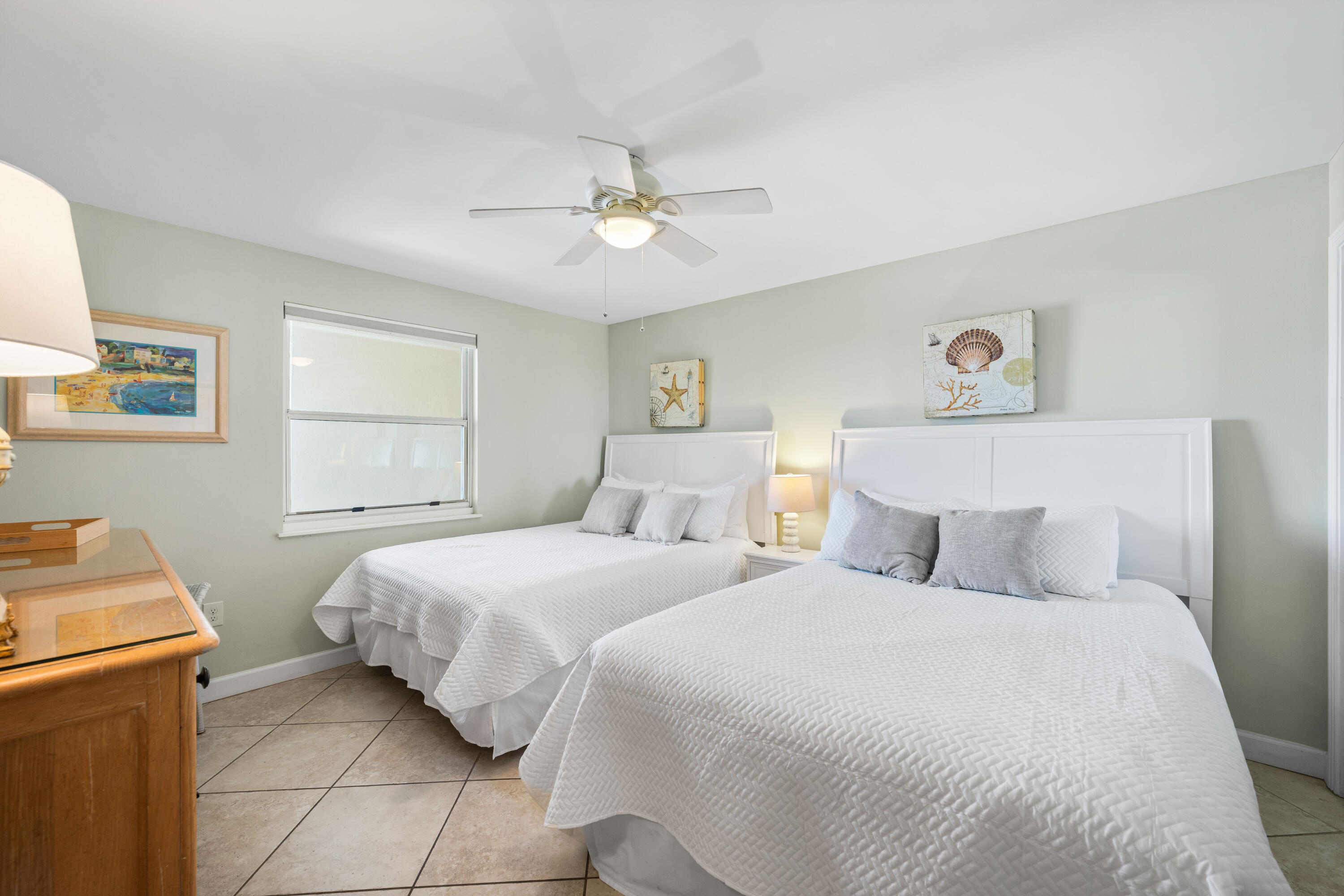 9815 Highway 98, Unit A1506 Miramar Beach, FL 32550 - Photo 14 of 44 a bedroom with a bed and a chandelier
