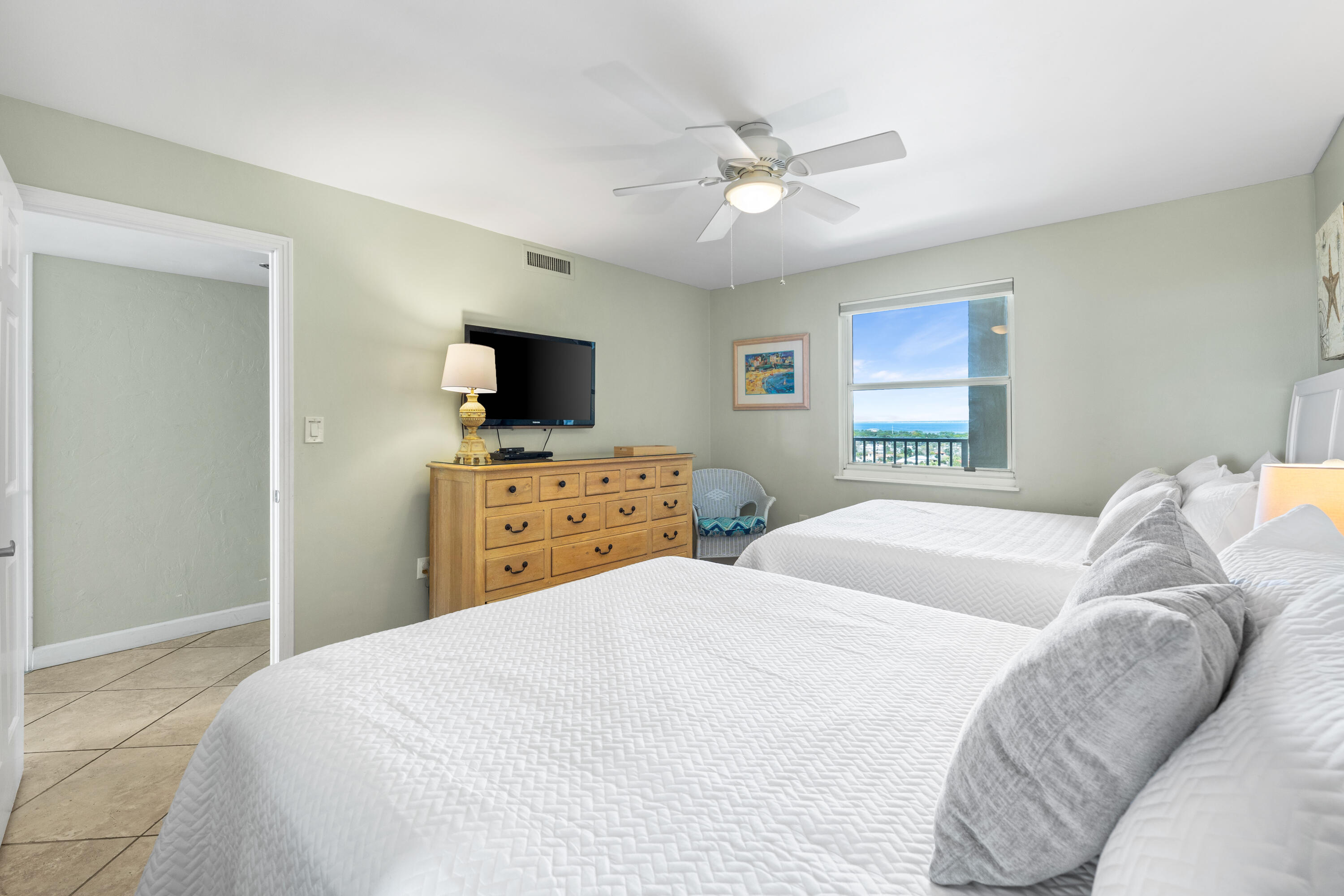 9815 Highway 98, Unit A1506 Miramar Beach, FL 32550 - Photo 15 of 44 a bedroom with a bed and a flat screen tv