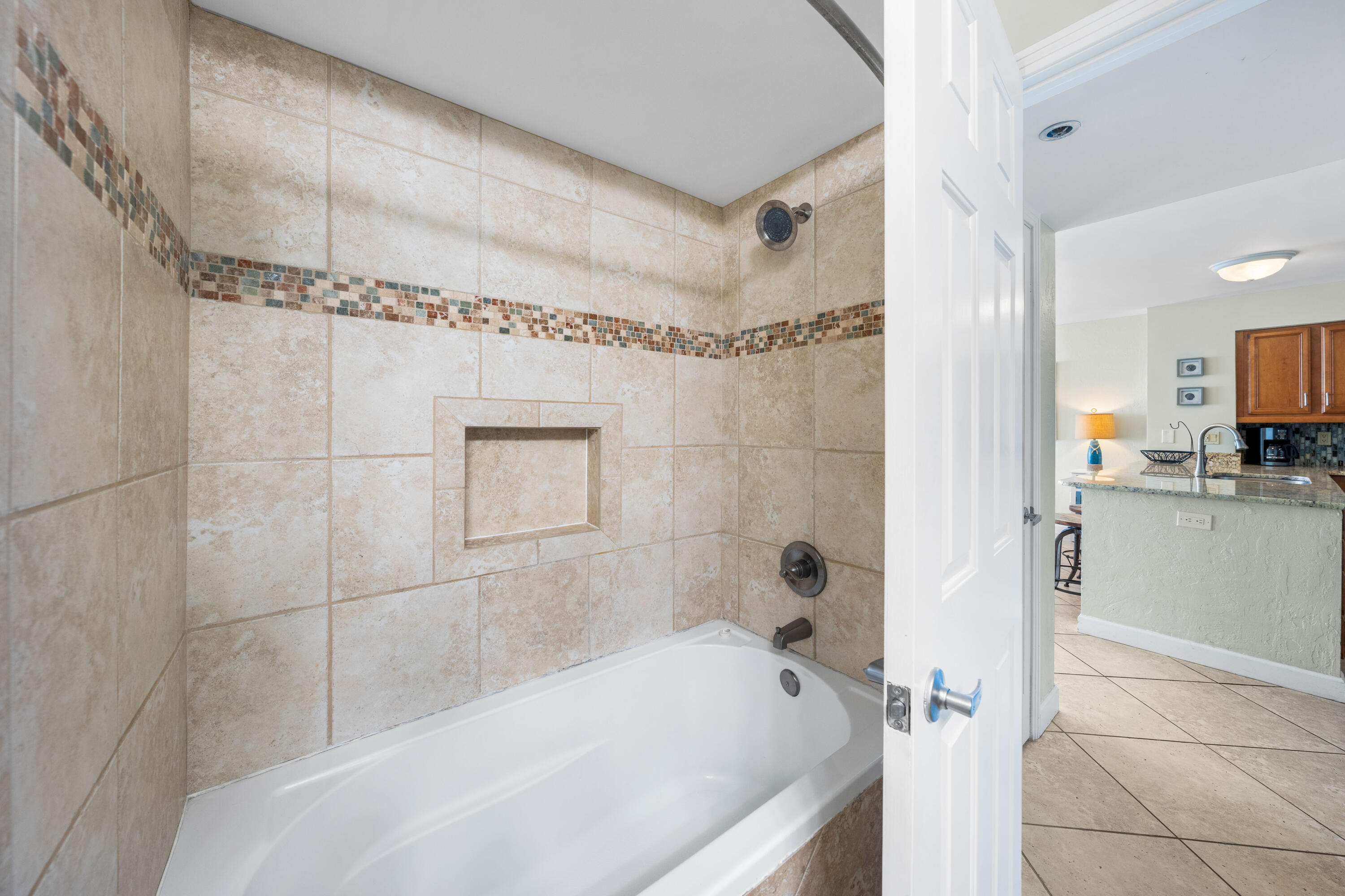 9815 Highway 98, Unit A1506 Miramar Beach, FL 32550 - Photo 18 of 44 a bathroom with a bathtub and a shower