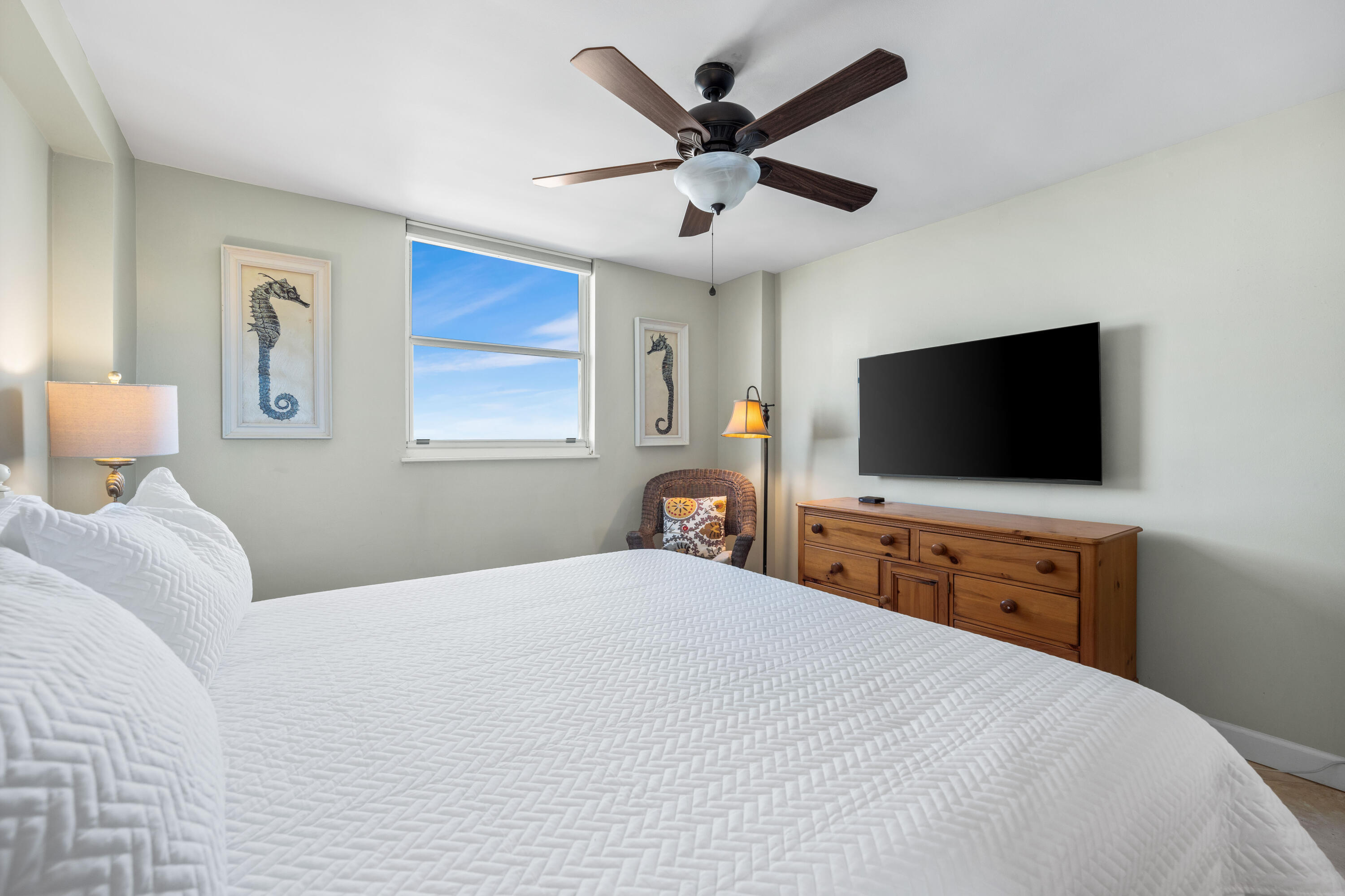 9815 Highway 98, Unit A1506 Miramar Beach, FL 32550 - Photo 20 of 44 a bedroom with a bed and a flat screen tv
