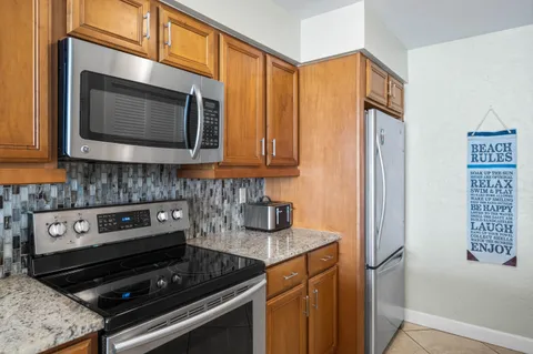 a kitchen with a stove and a microwave