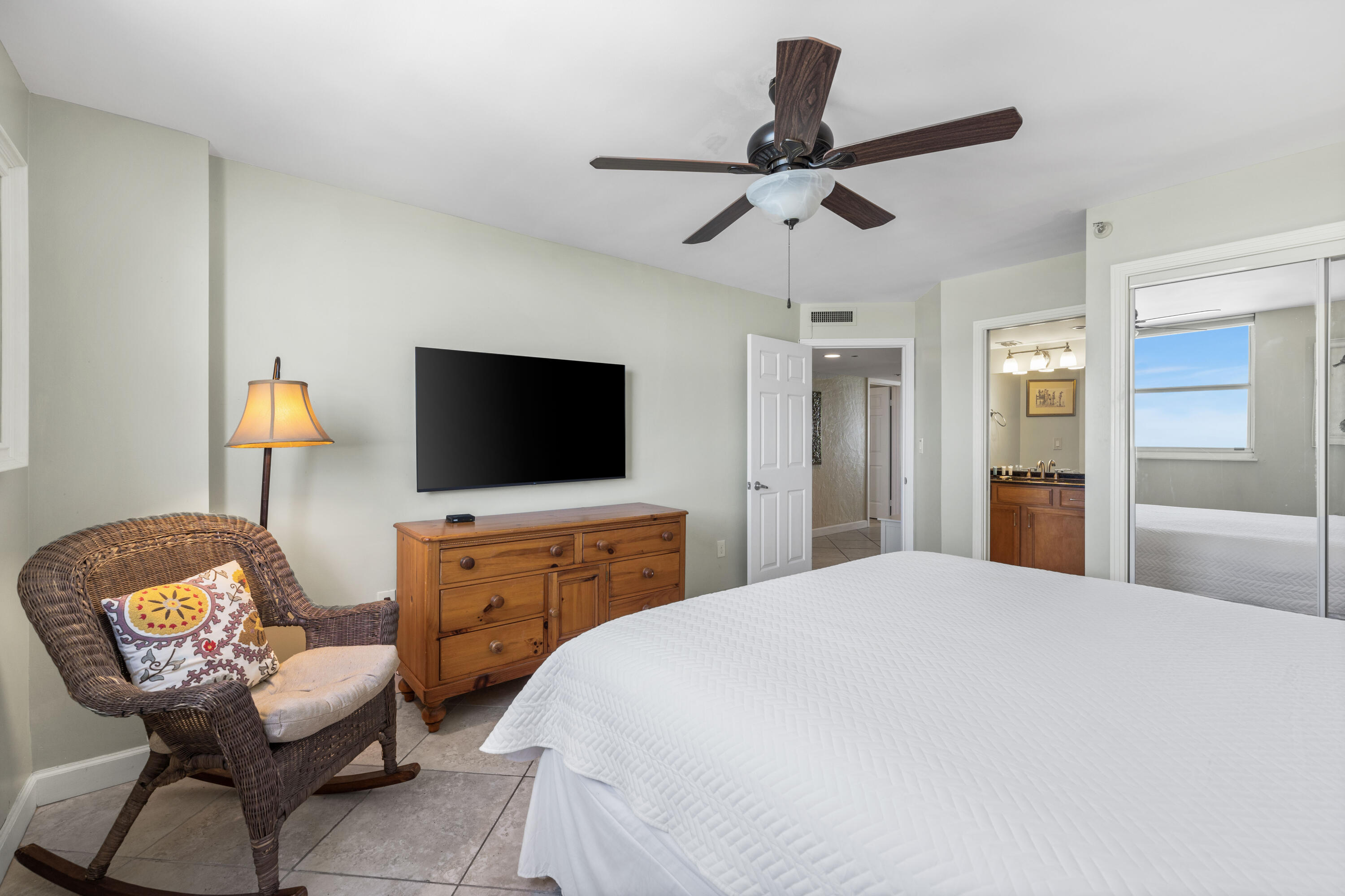 9815 Highway 98, Unit A1506 Miramar Beach, FL 32550 - Photo 21 of 44 a bedroom with a bed and a flat screen tv