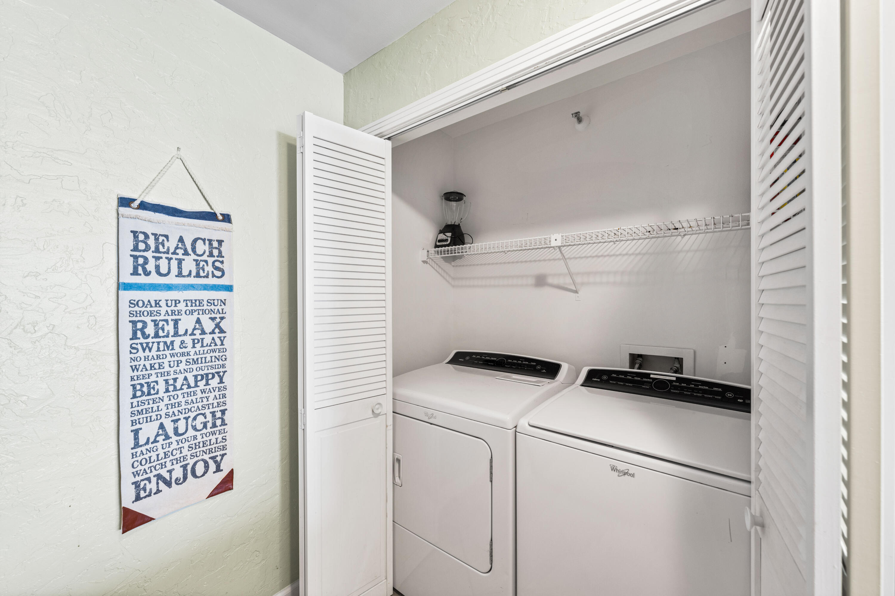 9815 Highway 98, Unit A1506 Miramar Beach, FL 32550 - Photo 24 of 44 a utility room with dryer and washer