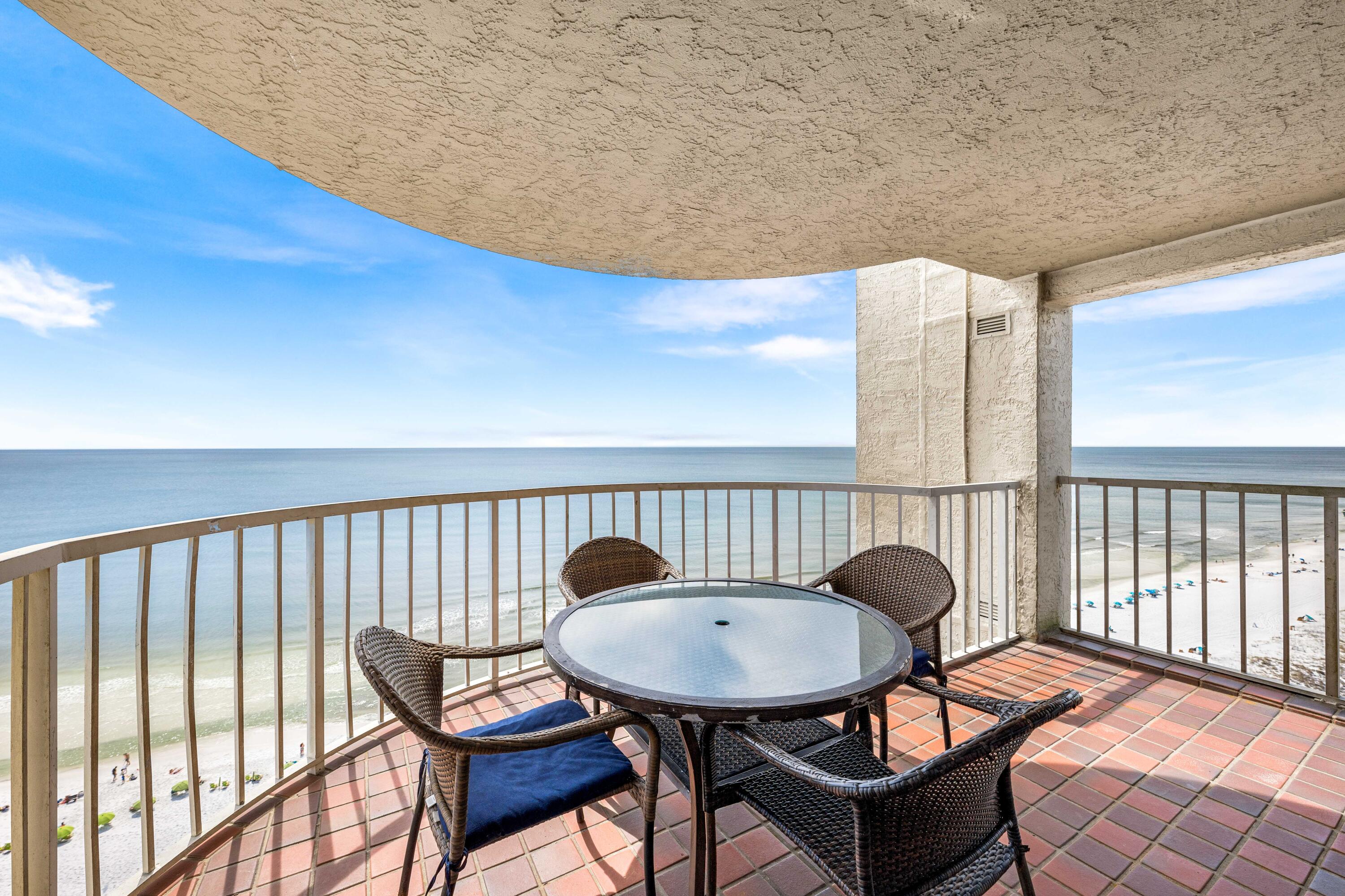 9815 Highway 98, Unit A1506 Miramar Beach, FL 32550 - Photo 26 of 44 a view of balcony with wooden floor table and chairs