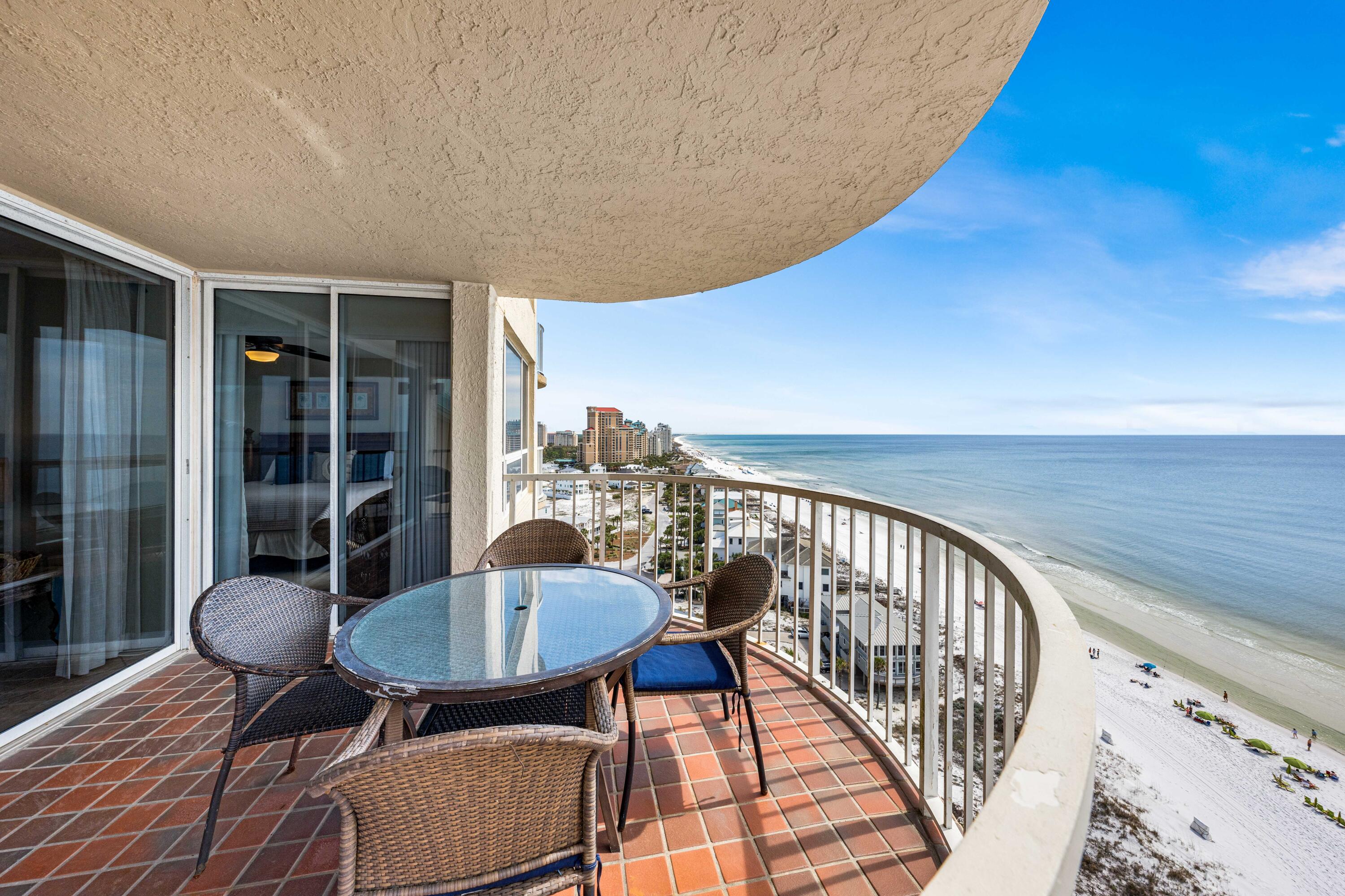 9815 Highway 98, Unit A1506 Miramar Beach, FL 32550 - Photo 27 of 44 a balcony with table and chairs