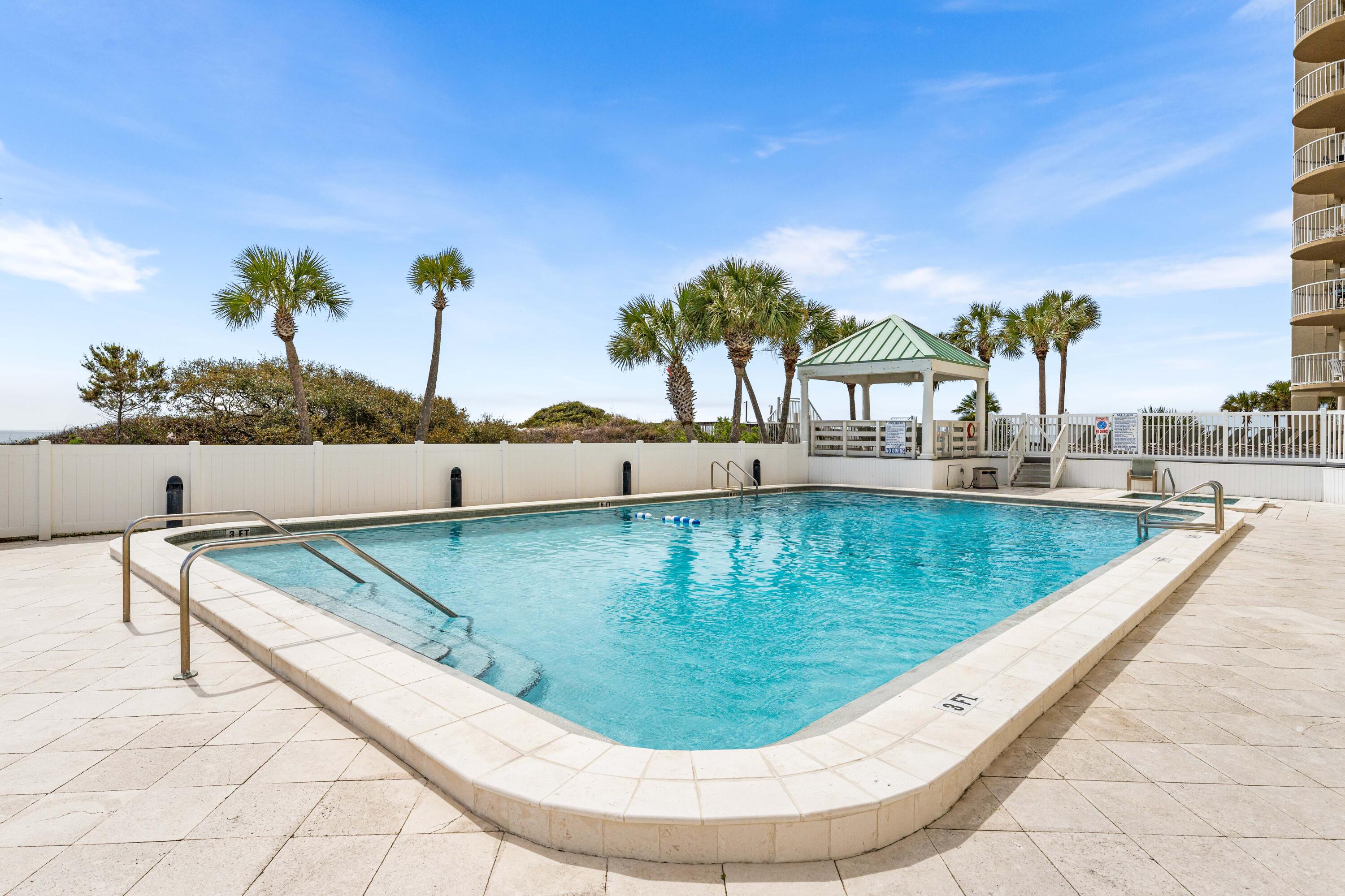 9815 Highway 98, Unit A1506 Miramar Beach, FL 32550 - Photo 33 of 44 a view of a swimming pool with a lounge chair