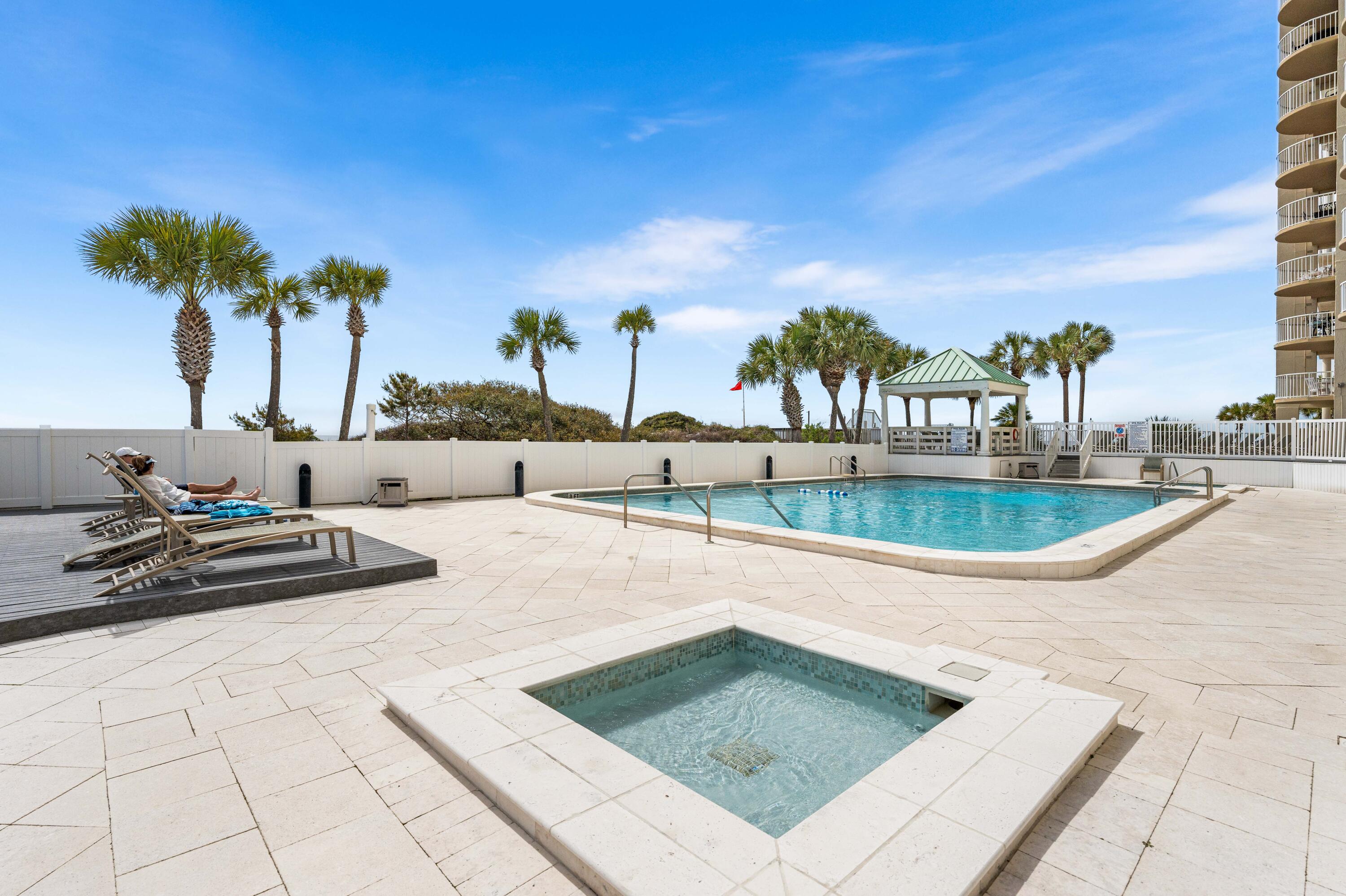 9815 Highway 98, Unit A1506 Miramar Beach, FL 32550 - Photo 34 of 44 a view of swimming pool with outdoor seating and plants