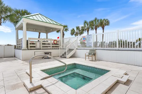 a view of a swimming pool with a lounge chairs