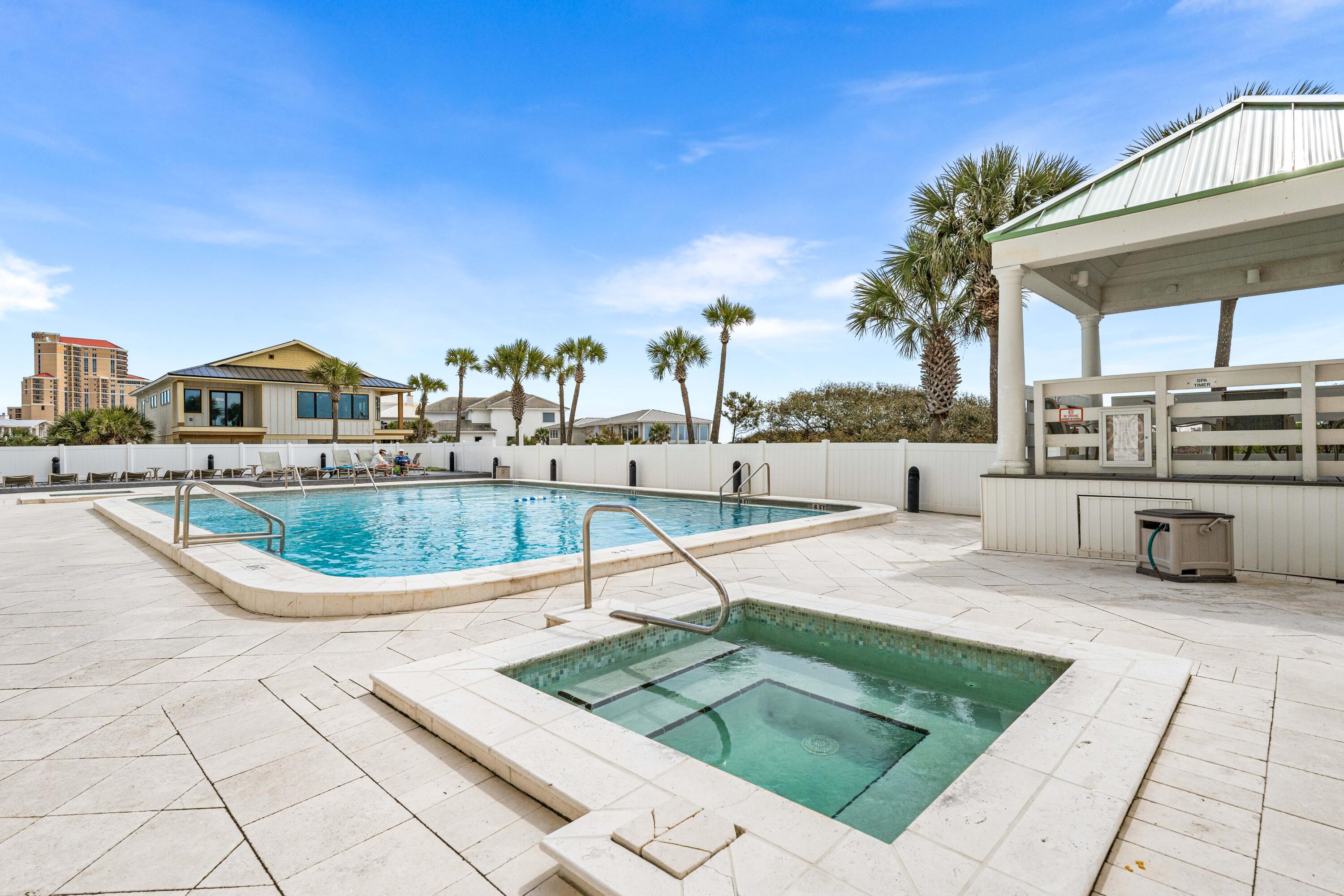 9815 Highway 98, Unit A1506 Miramar Beach, FL 32550 - Photo 36 of 44 a view of a swimming pool with a lounge chairs