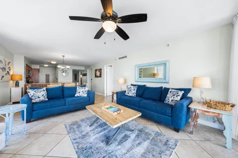 a living room with furniture and a rug