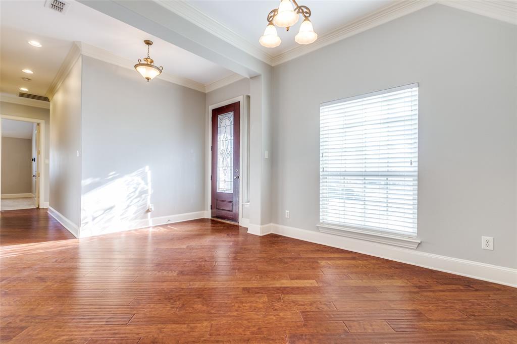 131 North Ridge Trail Prosper, TX 75078 - Photo 4 of 25 an empty room with wooden floor and windows
