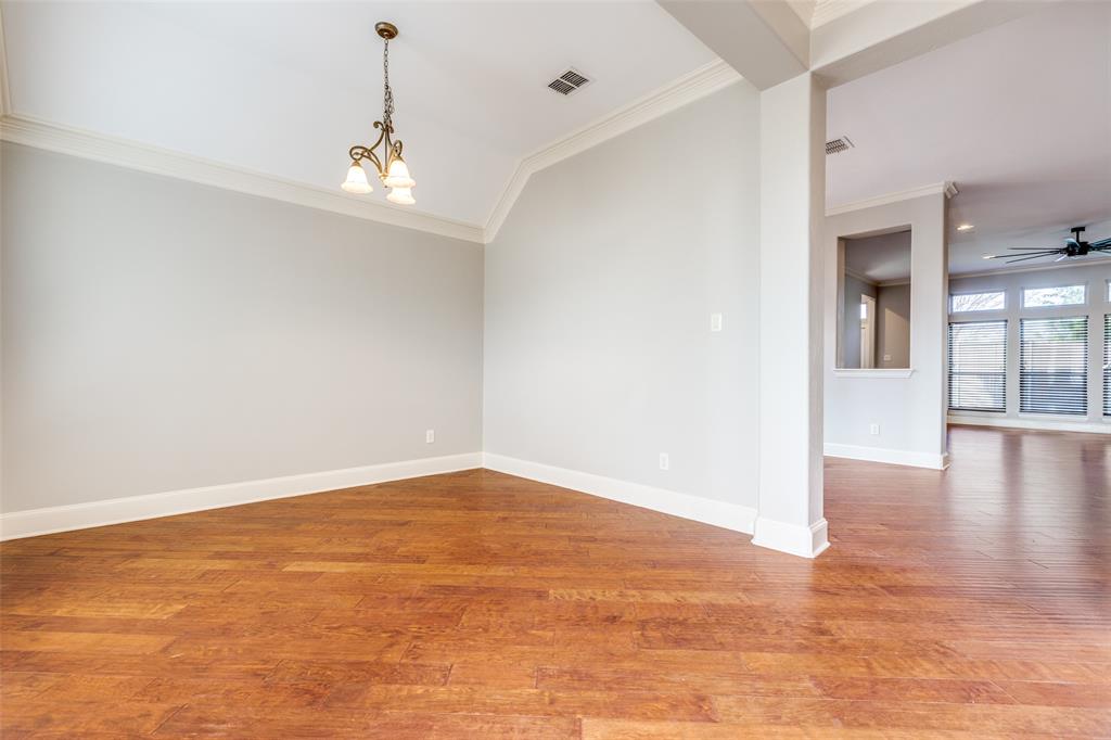 131 North Ridge Trail Prosper, TX 75078 - Photo 5 of 25 an empty room with wooden floor and windows