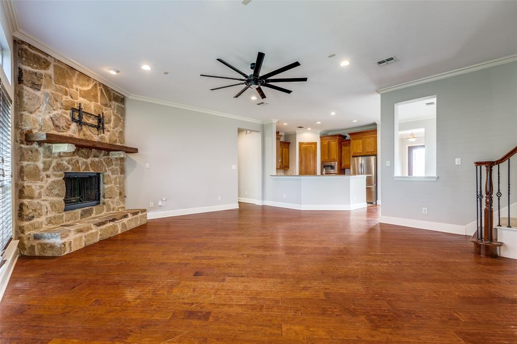 131 North Ridge Trail Prosper, TX 75078 - Photo 8 of 25 a view of an empty room with a fireplace and a window