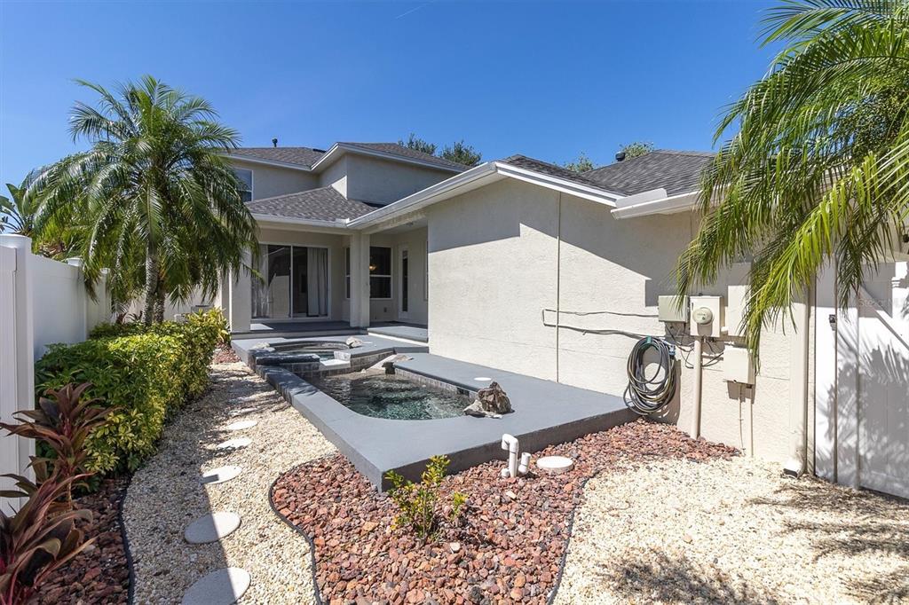 10121 Porch Street New Port Richey, FL 34655 - Photo 41 of 57 a front view of a house with garden