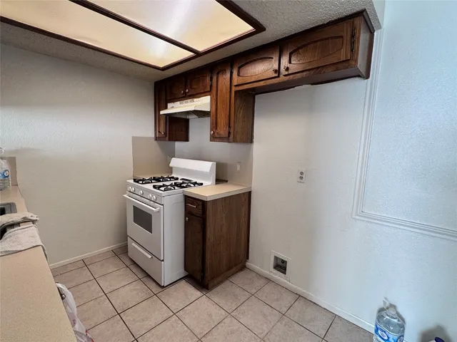 a kitchen with a stove and a microwave