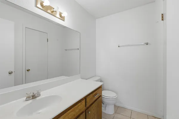 a bathroom with a sink toilet and vanity