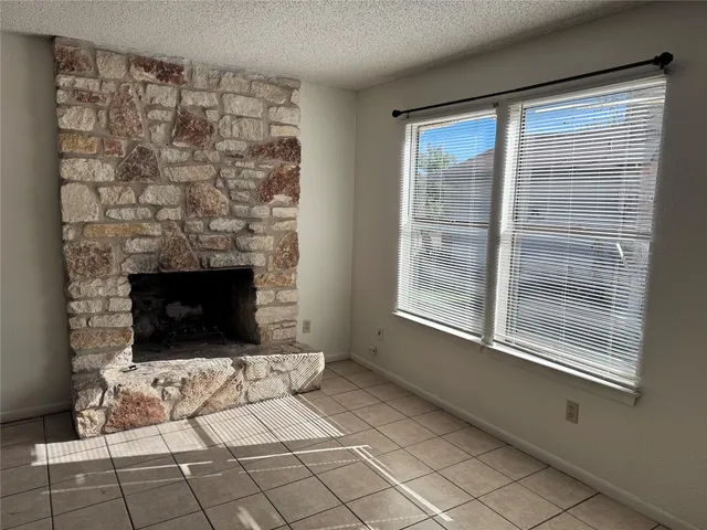 a living room with a fireplace