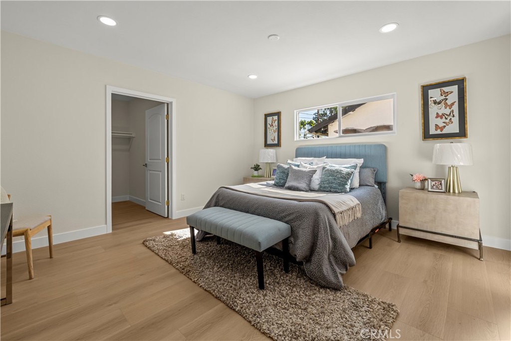 16931 Rinaldi Street Granada Hills, CA 91344 - Photo 14 of 46 a bed room with a bed and a couch