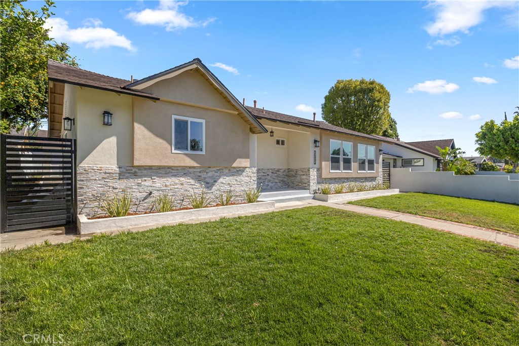 16931 Rinaldi Street Granada Hills, CA 91344 - Photo 3 of 46 a front view of house with yard and outdoor seating