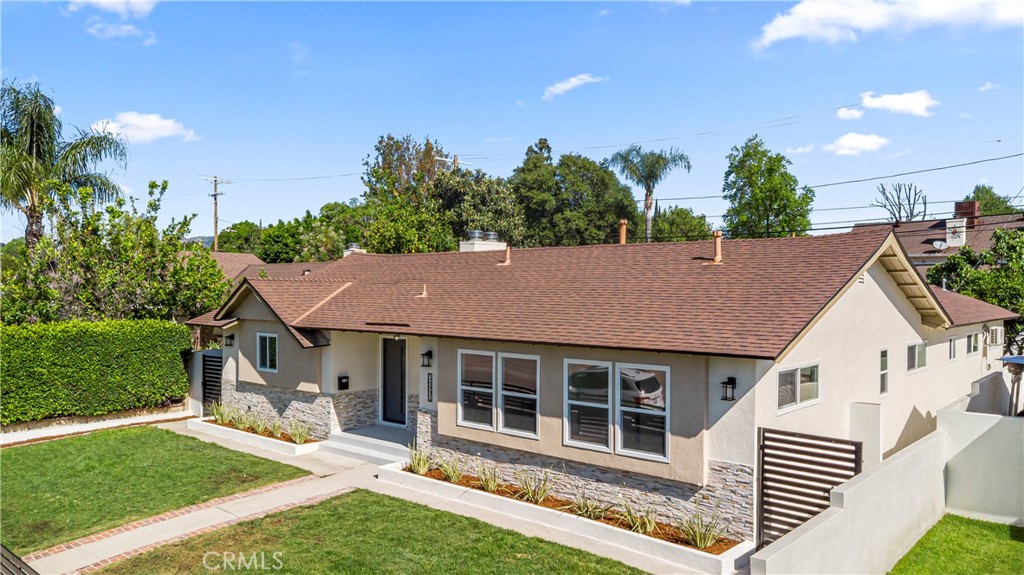 16931 Rinaldi Street Granada Hills, CA 91344 - Photo 4 of 46 a aerial view of a house with a yard