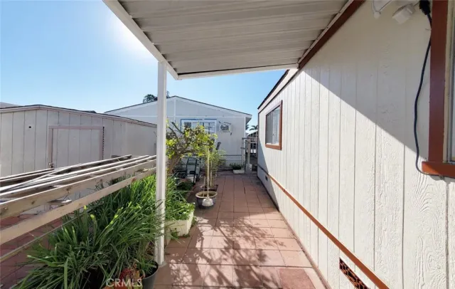 a view of a backyard with pathway