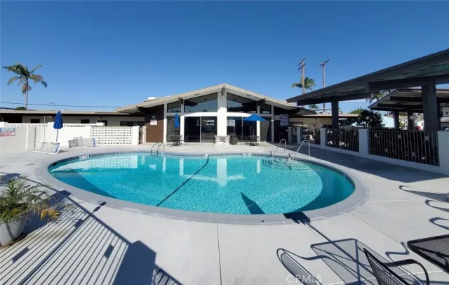 a view of a swimming pool with a patio