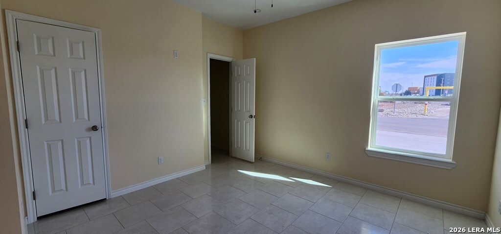 118 Grass Valley Road, Unit 201 Eagle Pass, TX 78852 - Photo 8 of 26 an empty room with windows and closet