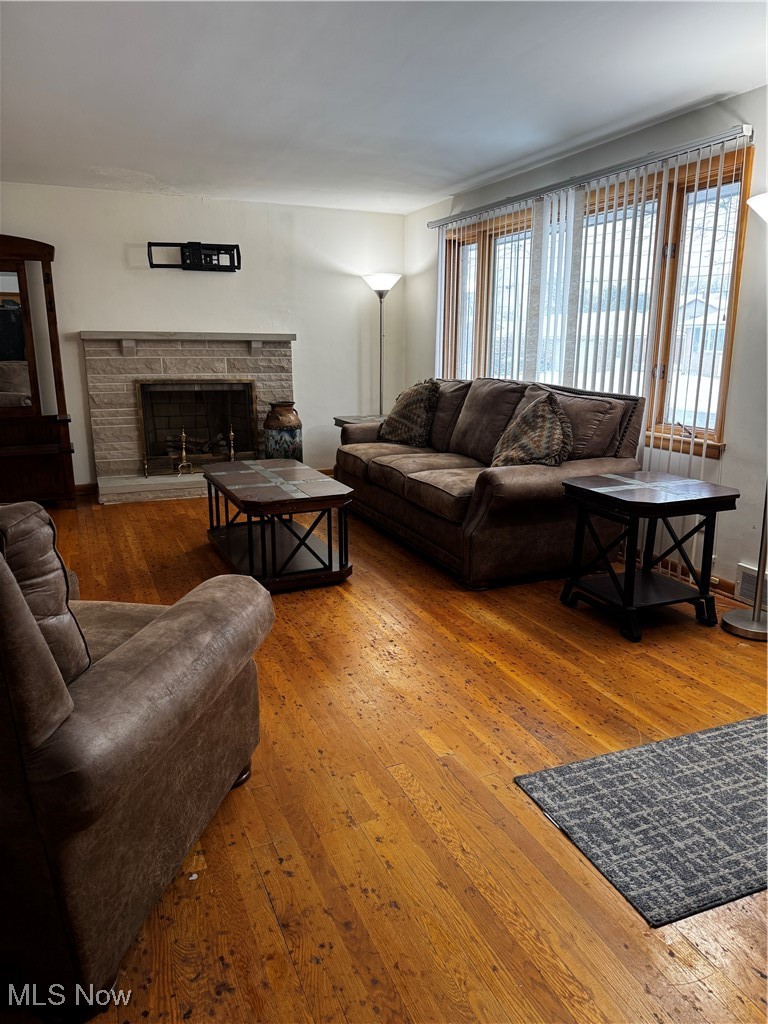 4531 8th Street Northwest Canton, OH 44708 - Photo 5 of 19 Living room with a stone fireplace and hardwood / wood-style floors