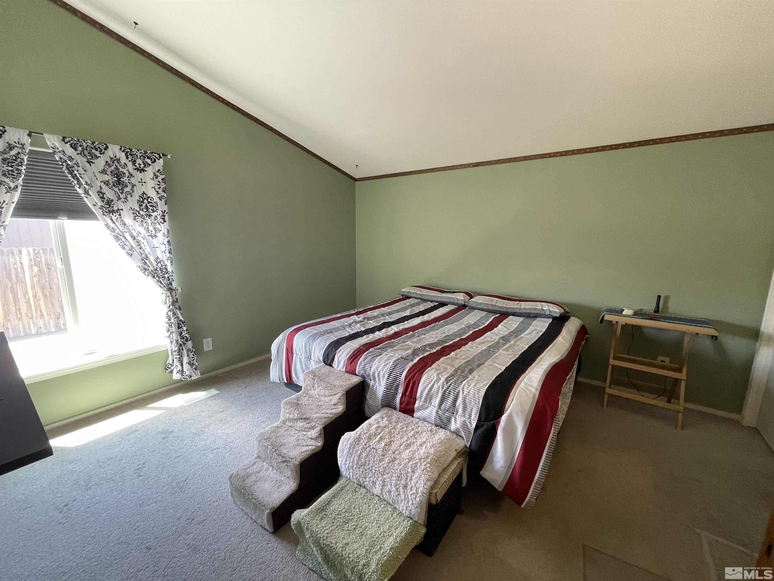 4045 Grouse Way Reno, NV 89508 - Photo 8 of 22 a bedroom with a bed and a window