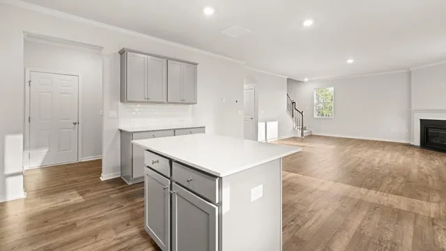 a kitchen with a sink and a refrigerator