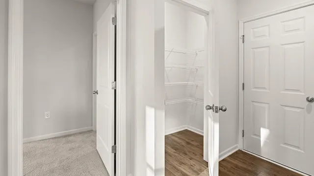 a view of a bathroom with white wooden floor