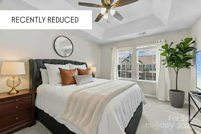 a front view of a house with yard and tress