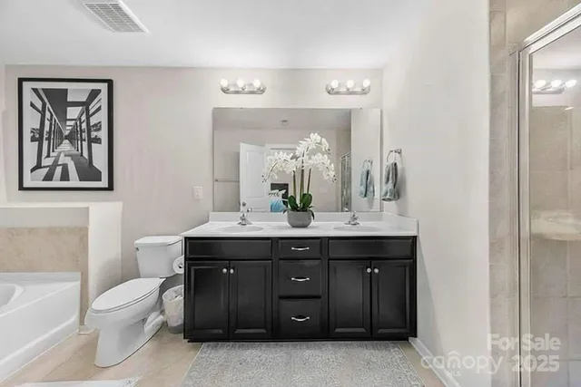 an aerial view of residential houses with outdoor space and street view